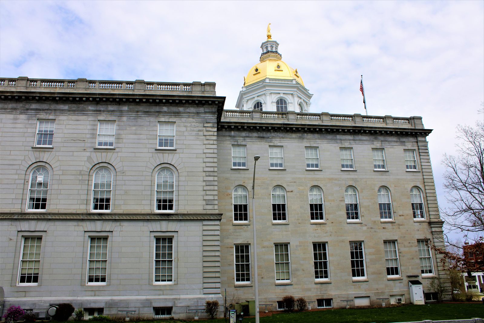 The eagle statue and gold dome of the New Hampshire State House in Concord