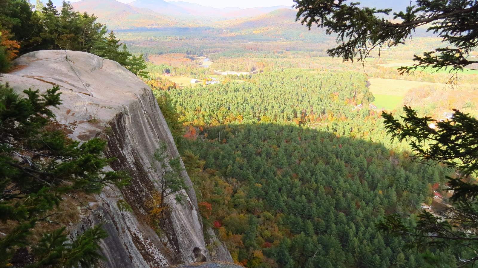 Granite ledge overlooking a forested valley at Cathedral Ledge