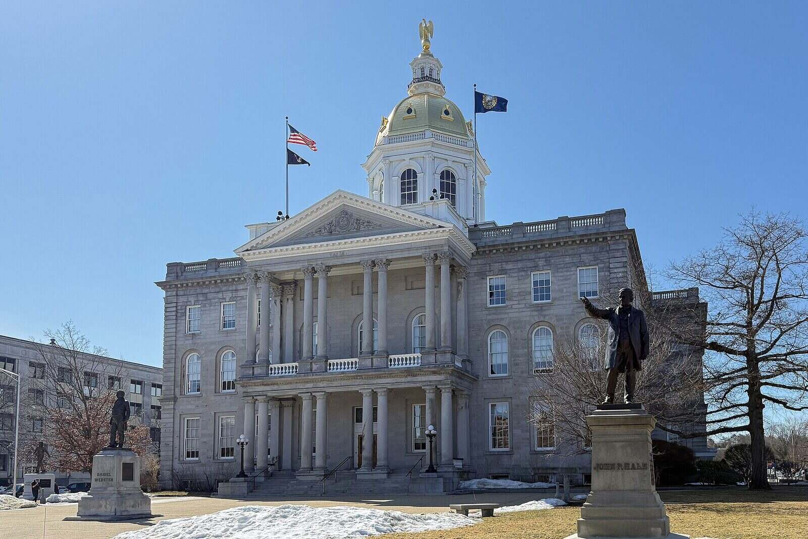 New Hampshire State House gold dome and front portico in Concord