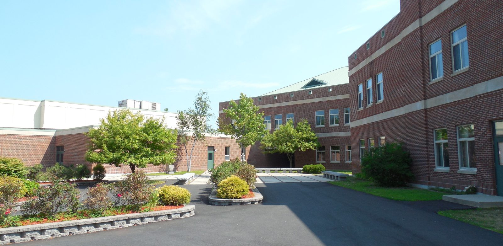 Brick buildings and courtyard of West Running Brook Middle School in Derry, New Hampshire