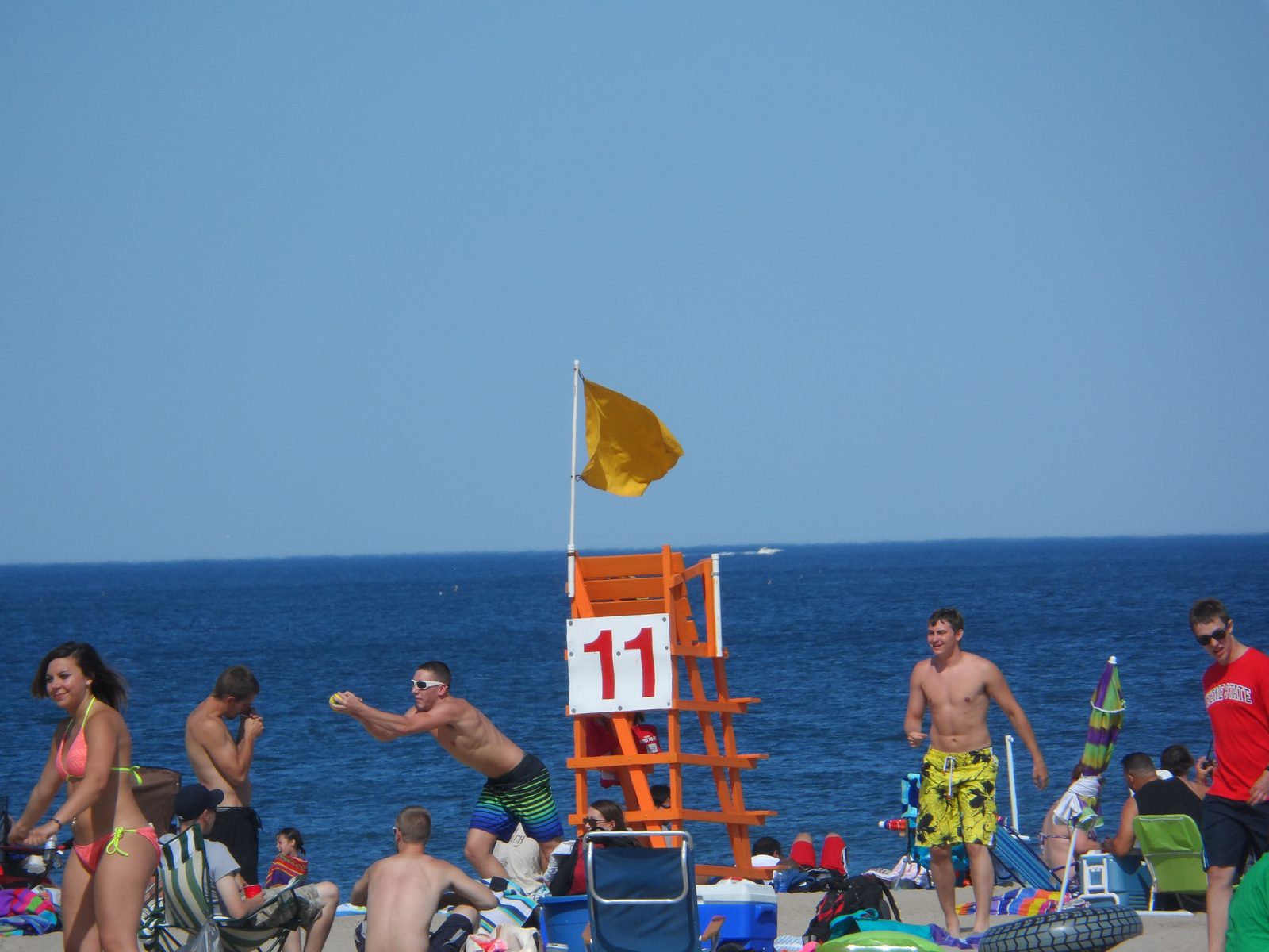 People on the sand around lifeguard stand 11 at Hampton Beach