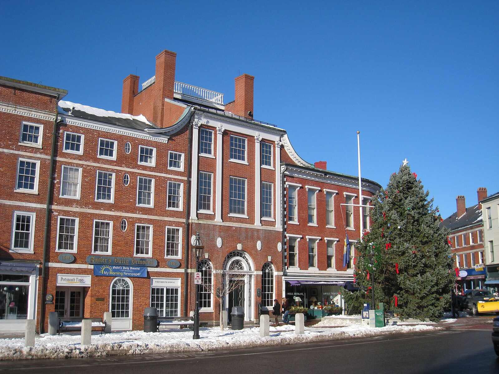 Brick storefronts and a winter sidewalk at Market Square in Portsmouth